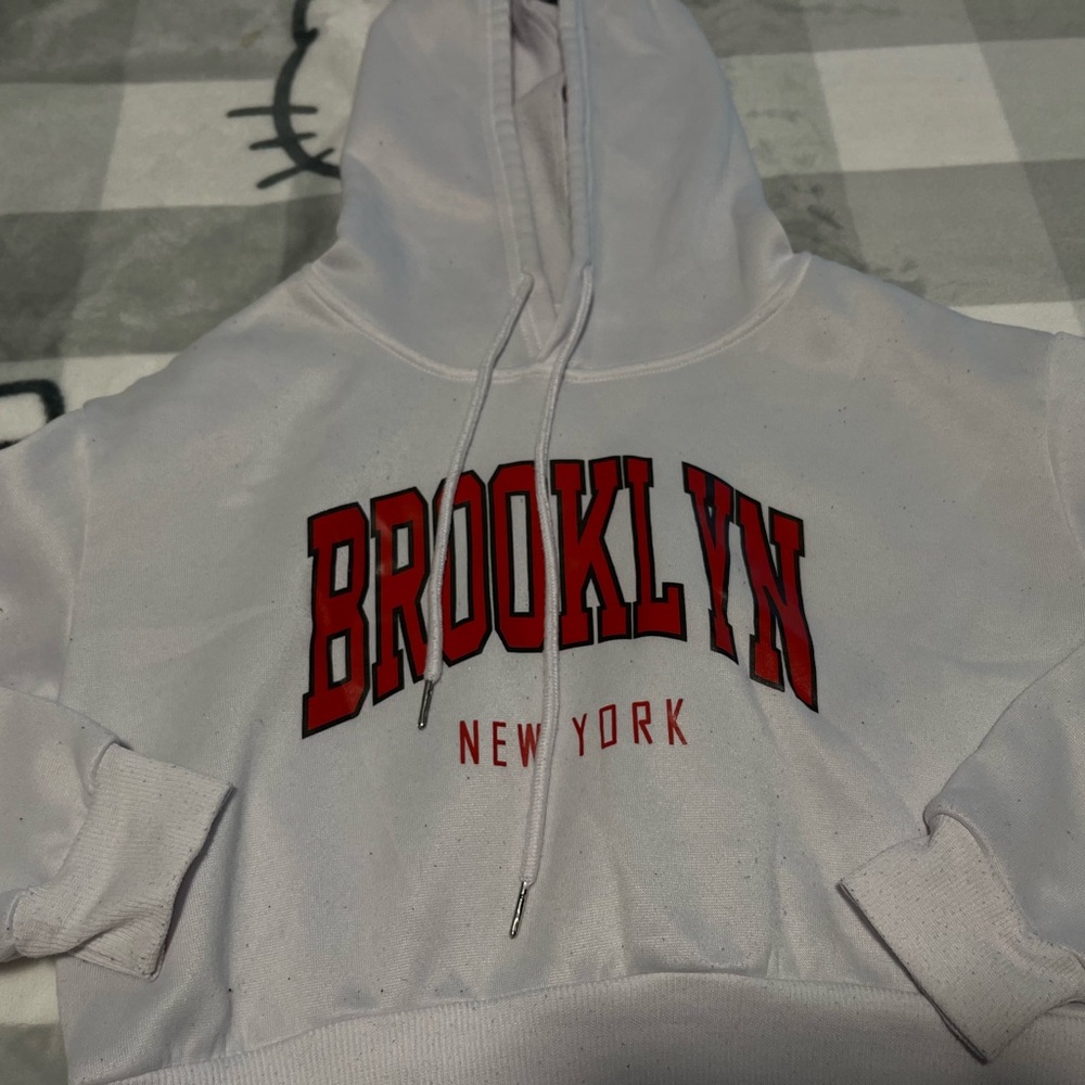 Cute white Brooklyn ny hoodie with lint can be cleaned off